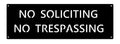 Metal NO SOLICITING No TRESPASSING sign in copper patina